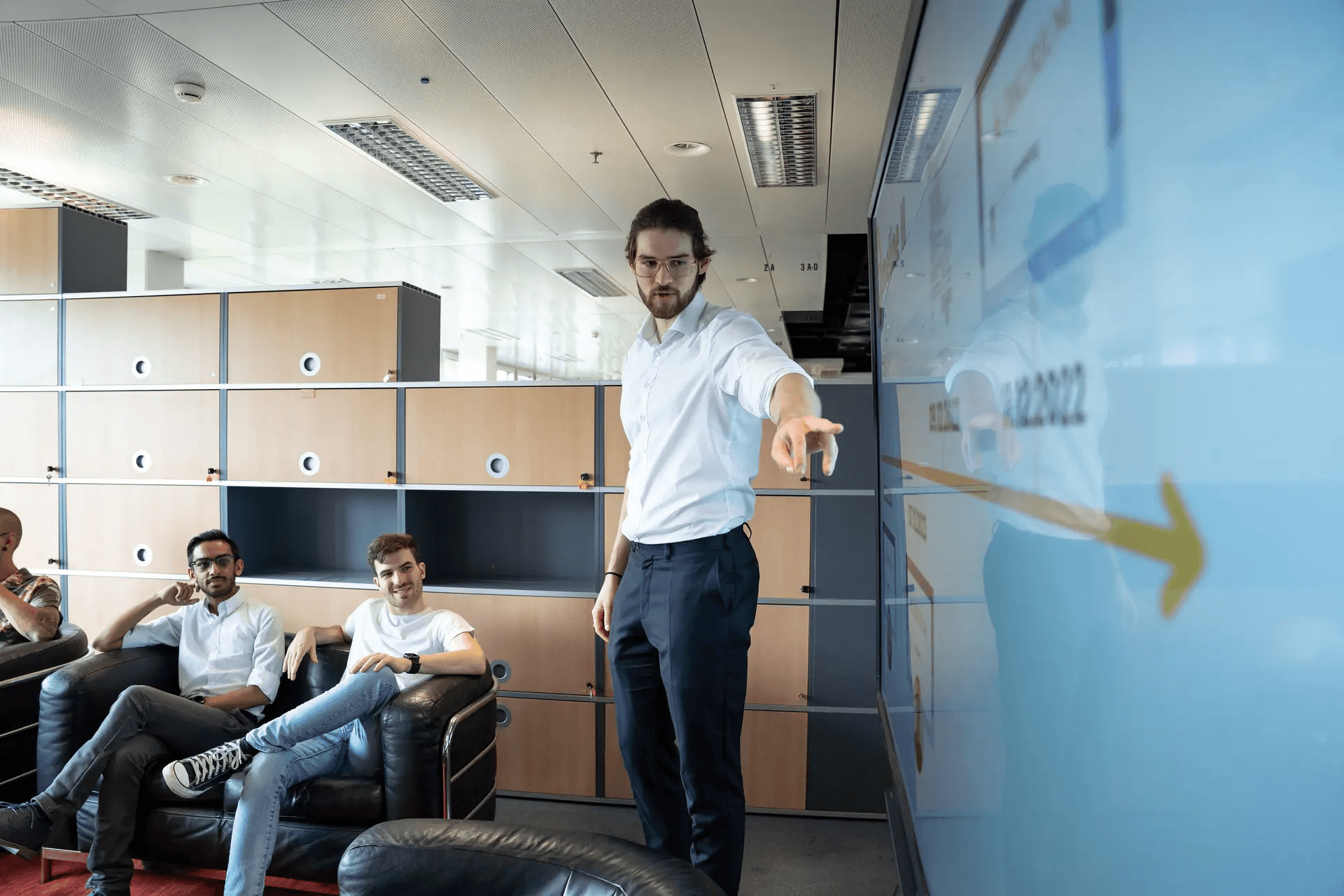 Man pointing at presentation.